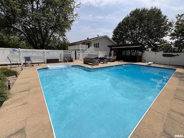 462 Circle Dr, Kewanee, IL 61443 - view of swimming pool with a fenced backyard, a wooden deck, stairs, a patio area, and a diving board