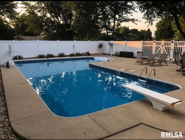 462 Circle Dr, Kewanee, IL 61443 - view of pool featuring a patio, a fenced backyard, and a diving board