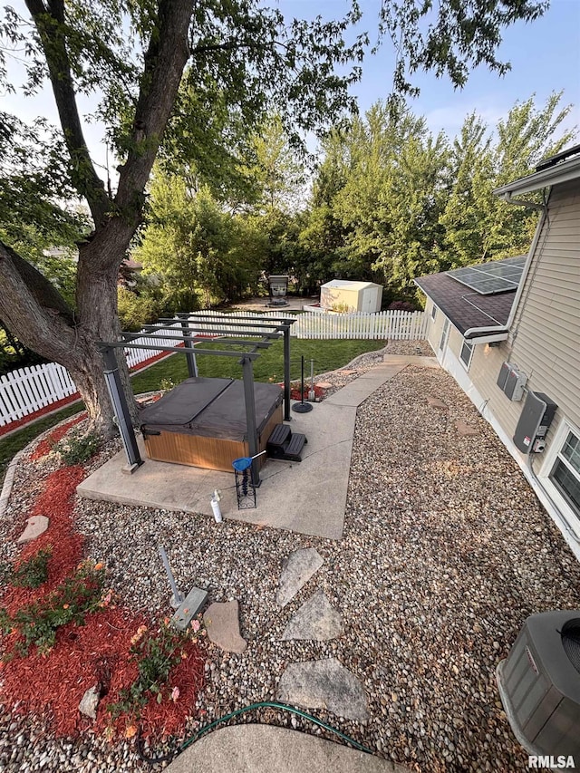 462 Circle Dr, Kewanee, IL 61443 - fenced backyard with a patio and a covered hot tub