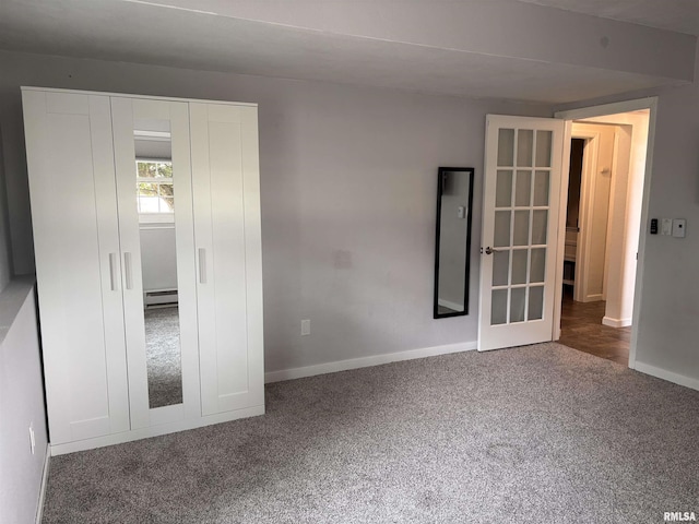 462 Circle Dr, Kewanee, IL 61443 - carpeted spare room featuring baseboard heating, baseboards, and french doors