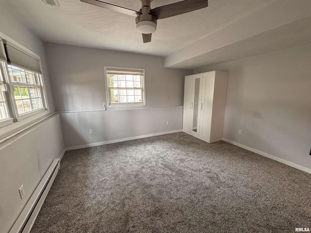 462 Circle Dr, Kewanee, IL 61443 - unfurnished bedroom with a baseboard heating unit, carpet flooring, baseboards, and a ceiling fan