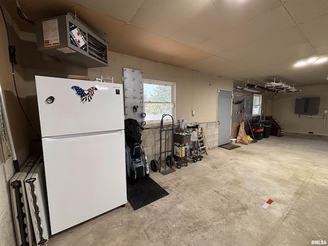 462 Circle Dr, Kewanee, IL 61443 - garage featuring freestanding refrigerator and a heating unit