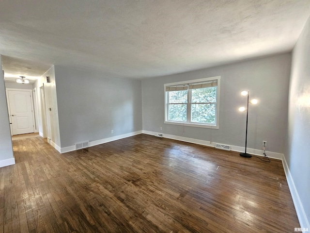 4325 N Lincoln Ave, Davenport, IA 52806 - empty room with dark wood-style floors and baseboards