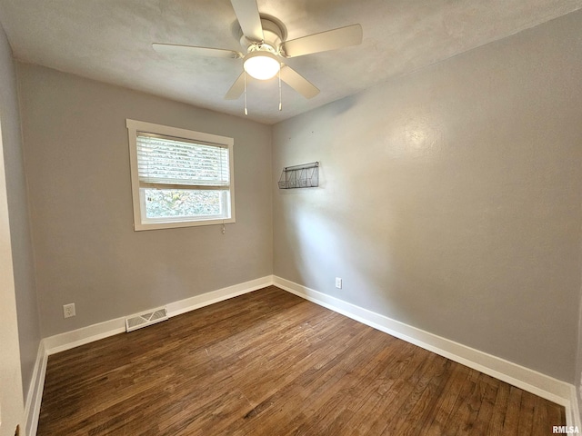 4325 N Lincoln Ave, Davenport, IA 52806 - spare room featuring dark wood finished floors, baseboards, and a ceiling fan