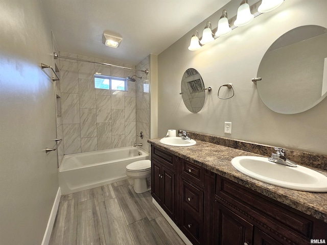 4325 N Lincoln Ave, Davenport, IA 52806 - full bath with toilet, double vanity, bathtub / shower combination, and wood finished floors