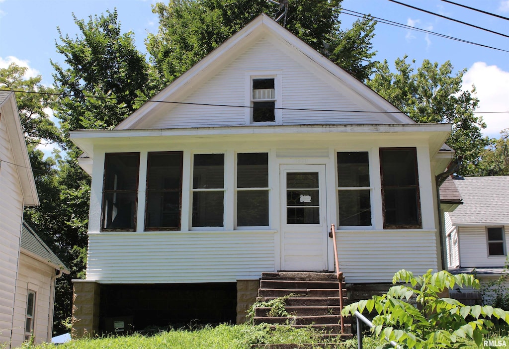 1309 Clay St, Davenport, IA 52804 - view of front of property featuring entry steps and a sunroom