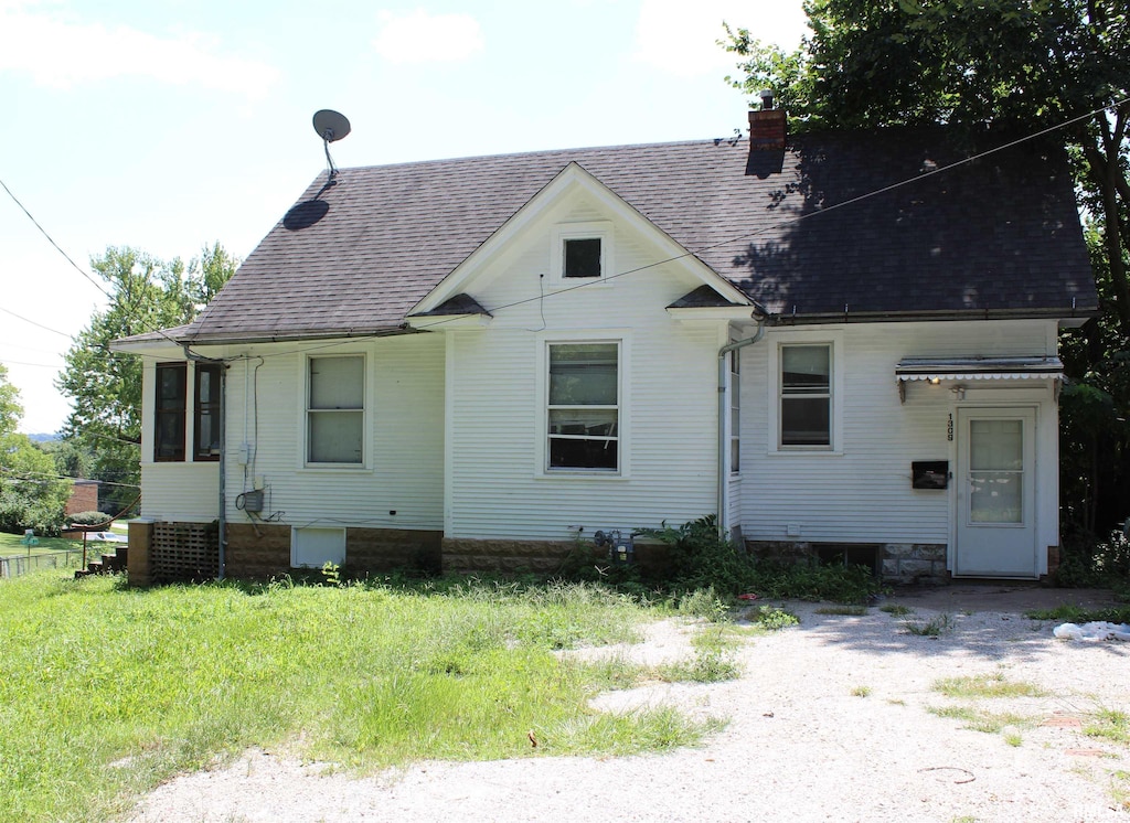 1309 Clay St, Davenport, IA 52804 - rear view of property featuring a chimney and roof with shingles
