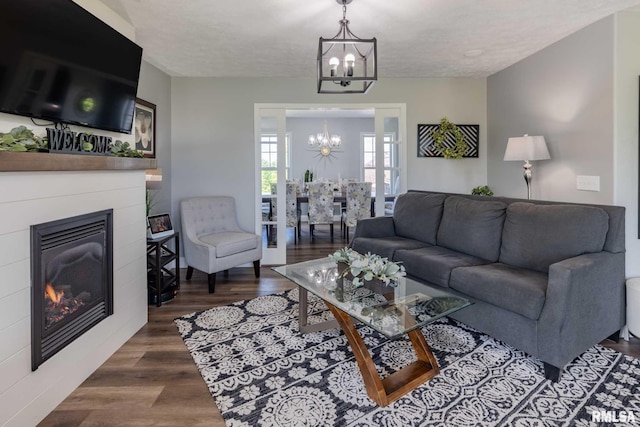 3160 Sycamore Rd, Carterville, IL 62918 - living area with a chandelier, wood finished floors, and a glass covered fireplace