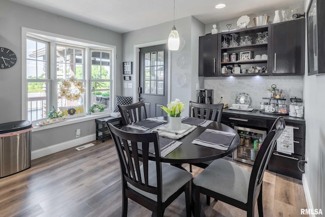 3160 Sycamore Rd, Carterville, IL 62918 - dining space featuring plenty of natural light, wood finished floors, and baseboards