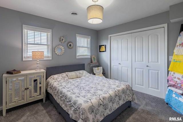 3160 Sycamore Rd, Carterville, IL 62918 - bedroom featuring dark colored carpet and a closet