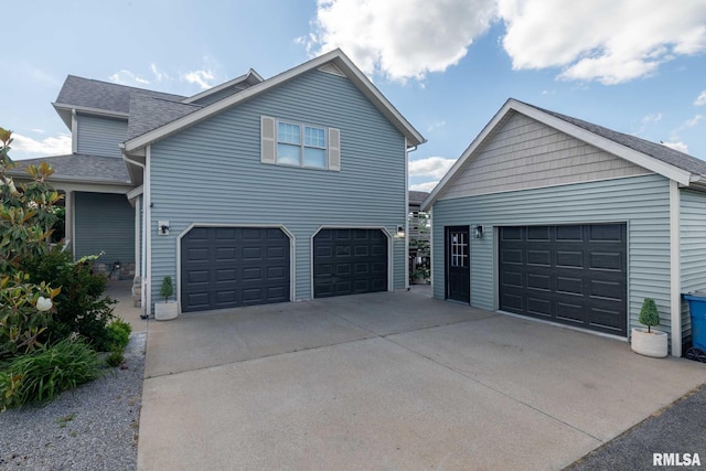 3160 Sycamore Rd, Carterville, IL 62918 - view of front of home with roof with shingles and an attached garage