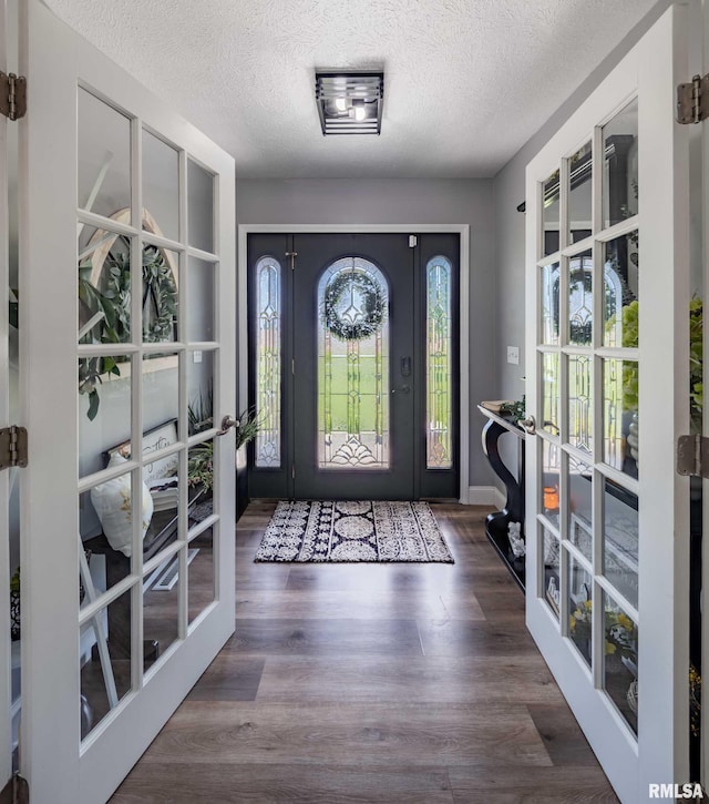 3160 Sycamore Rd, Carterville, IL 62918 - foyer featuring french doors, a textured ceiling, and wood finished floors