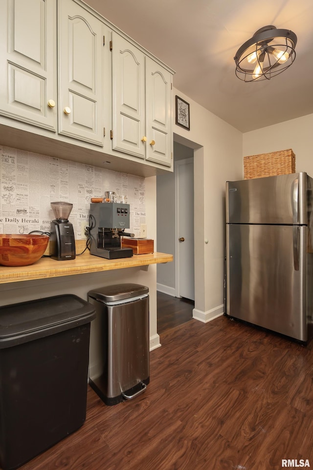 807 Spalding Blvd, Davenport, IA 52804 - kitchen with freestanding refrigerator, dark wood-type flooring, butcher block countertops, and white cabinets