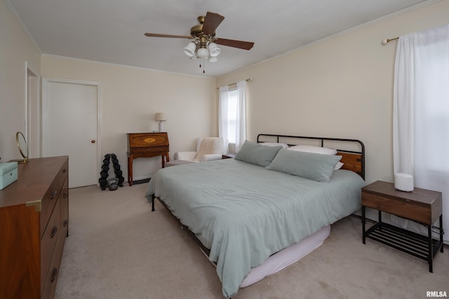 807 Spalding Blvd, Davenport, IA 52804 - bedroom with ornamental molding, light carpet, and a ceiling fan