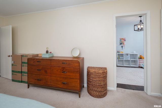 807 Spalding Blvd, Davenport, IA 52804 - bedroom featuring light carpet, crown molding, and a chandelier