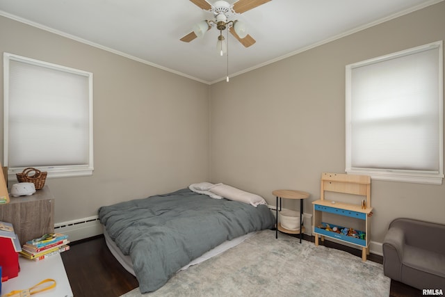 807 Spalding Blvd, Davenport, IA 52804 - bedroom with baseboard heating, wood finished floors, crown molding, multiple windows, and ceiling fan