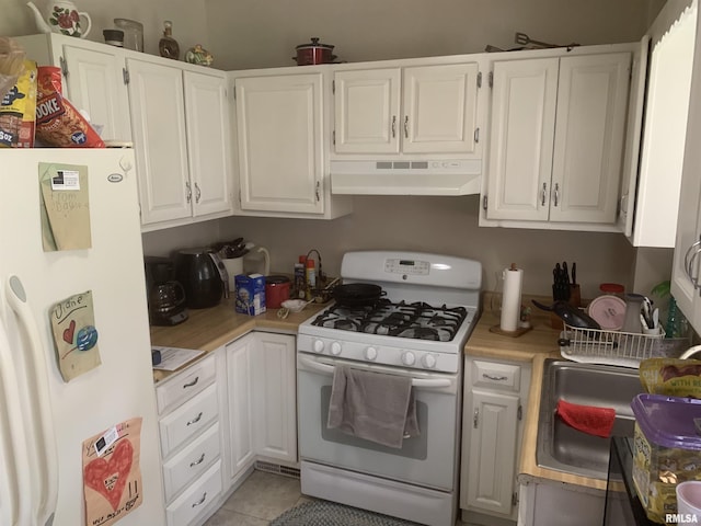 1424 29th Ave, Moline, IL 61265 - kitchen with white appliances, under cabinet range hood, light countertops, and white cabinetry