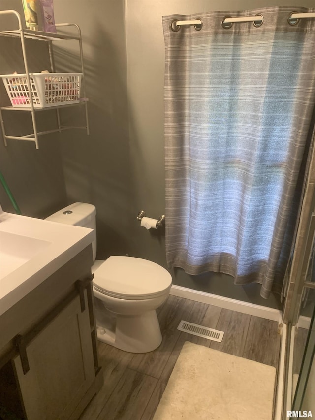 1424 29th Ave, Moline, IL 61265 - bathroom with wood finished floors, vanity, and a shower
