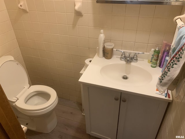 1424 29th Ave, Moline, IL 61265 - bathroom featuring vanity, tile walls, and wood finished floors
