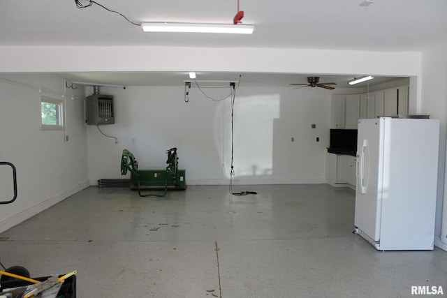 24176 Stagecoach Rd, Geneseo, IL 61254 - garage featuring freestanding refrigerator, ceiling fan, and baseboards