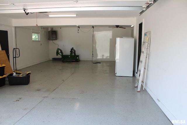 24176 Stagecoach Rd, Geneseo, IL 61254 - garage with freestanding refrigerator and baseboards