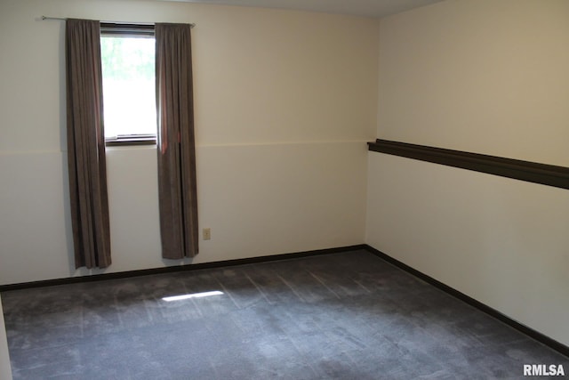 24176 Stagecoach Rd, Geneseo, IL 61254 - empty room with dark carpet and baseboards