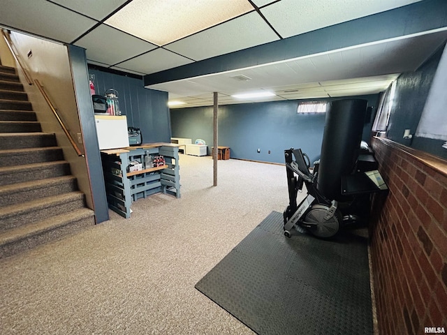 709S 4th St S, Maquoketa, IA 52060 - basement featuring carpet, stairway, and a paneled ceiling