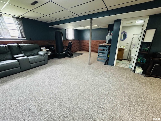 709S 4th St S, Maquoketa, IA 52060 - carpeted living room with a wainscoted wall, a drop ceiling, and healthy amount of natural light