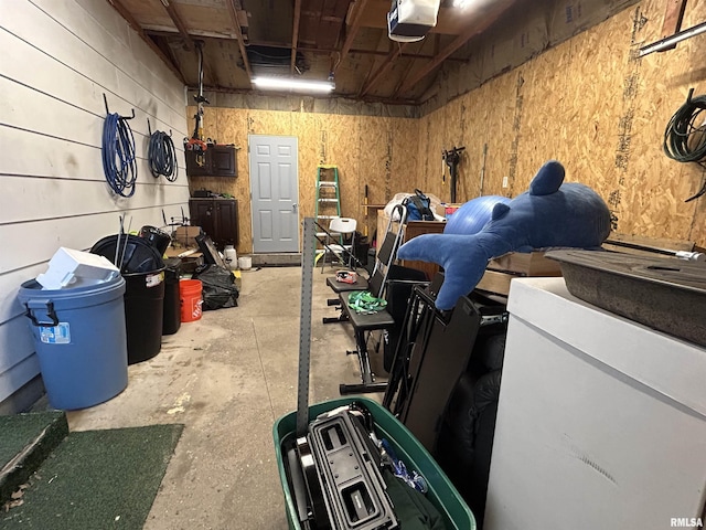 709S 4th St S, Maquoketa, IA 52060 - garage featuring a garage door opener