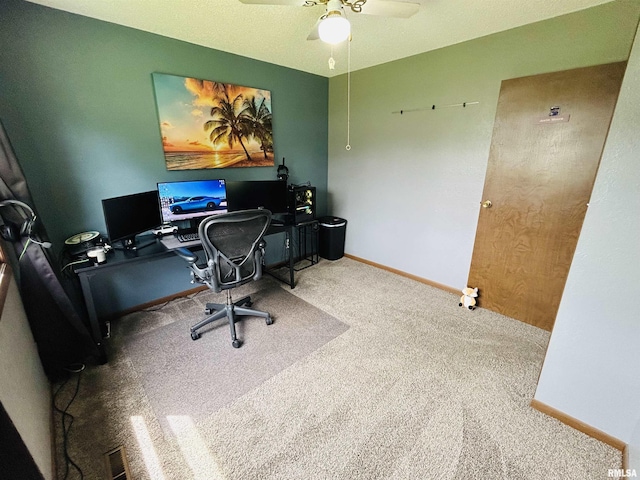 709S 4th St S, Maquoketa, IA 52060 - home office with carpet flooring, a ceiling fan, and baseboards