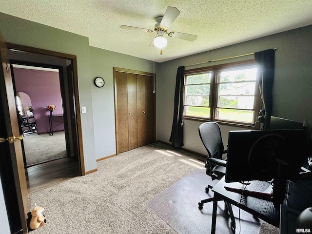 709S 4th St S, Maquoketa, IA 52060 - carpeted office space with ceiling fan, a textured ceiling, and baseboards