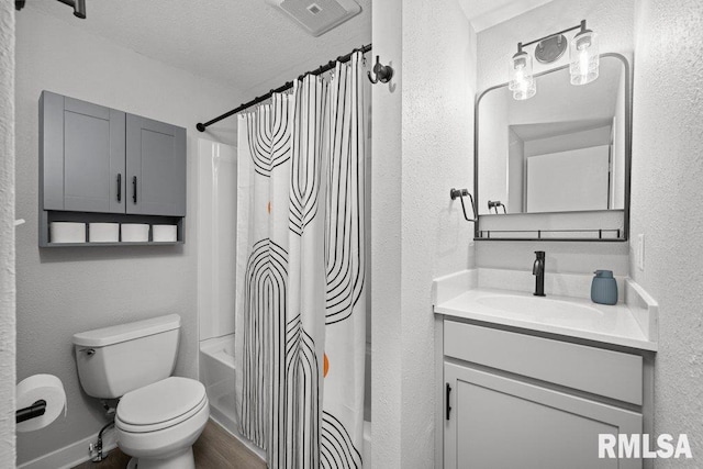 1156 23rd St, Moline, IL 61265 - bathroom featuring vanity, shower / tub combo with curtain, wood finished floors, a textured wall, and a textured ceiling