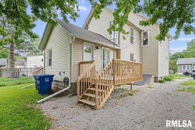 1156 23rd St, Moline, IL 61265 - view of front facade with a wooden deck and roof with shingles