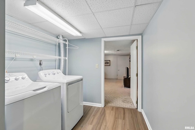 924 Brown St, Bettendorf, IA 52722 - washroom with washer and dryer, light wood-style flooring, and baseboards