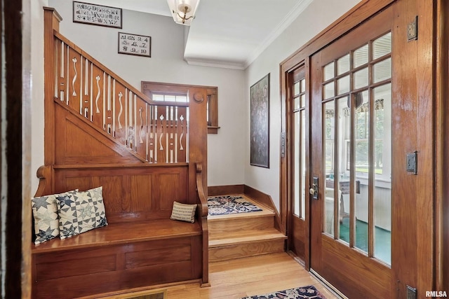 924 Brown St, Bettendorf, IA 52722 - foyer entrance with stairs, ornamental molding, plenty of natural light, and light wood finished floors