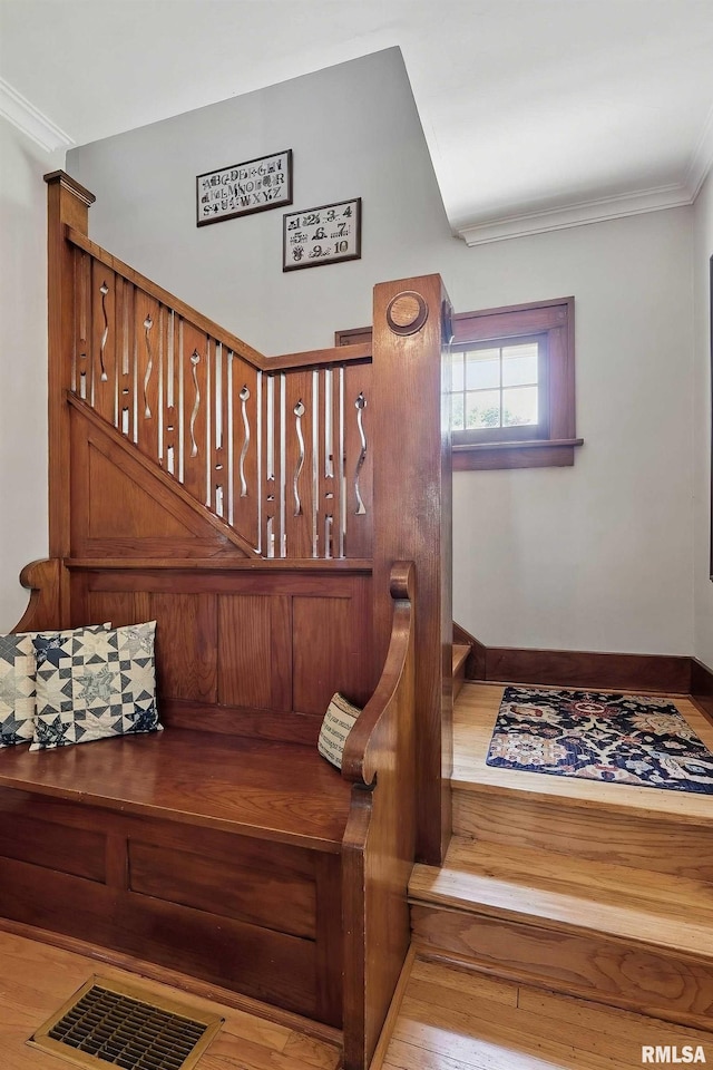 924 Brown St, Bettendorf, IA 52722 - stairs featuring ornamental molding, wood finished floors, and baseboards