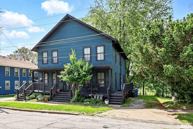 1931 E 11th St, Davenport, IA 52803 - american foursquare style home featuring a porch