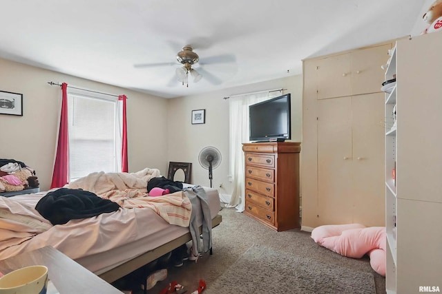 1931 E 11th St, Davenport, IA 52803 - carpeted bedroom featuring a ceiling fan