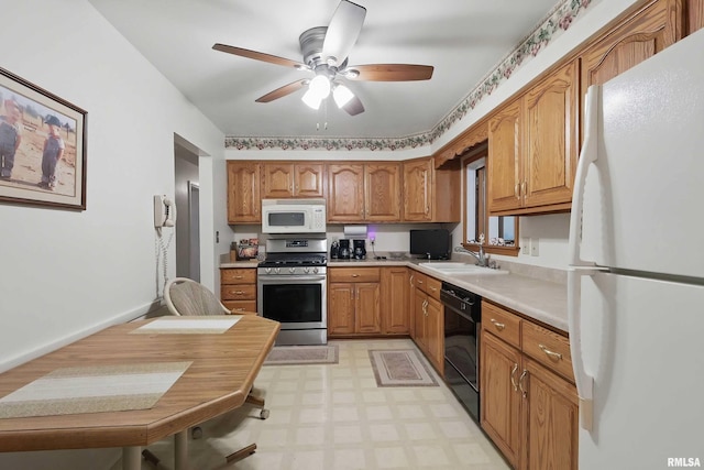 1119 14th St, Bettendorf, IA 52722 - kitchen featuring white appliances, a sink, light floors, ceiling fan, and light countertops
