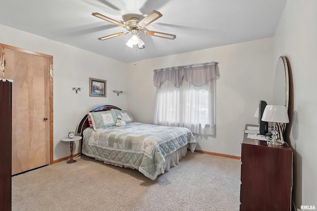 1119 14th St, Bettendorf, IA 52722 - bedroom with light colored carpet, baseboards, and a ceiling fan