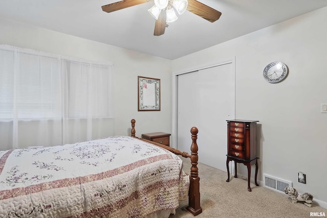 1119 14th St, Bettendorf, IA 52722 - bedroom featuring carpet flooring, a closet, and a ceiling fan