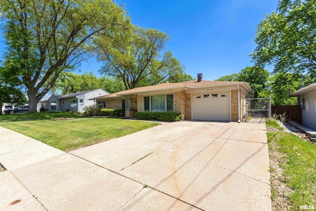 1119 14th St, Bettendorf, IA 52722 - view of front of house with a garage, brick siding, a gate, driveway, and a chimney