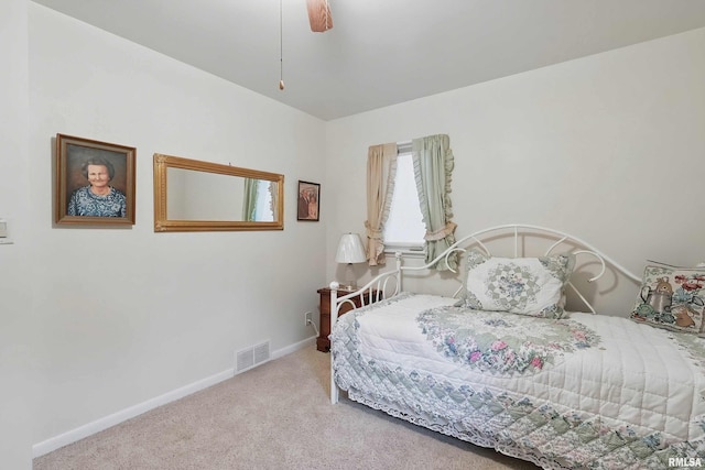 1119 14th St, Bettendorf, IA 52722 - carpeted bedroom with baseboards and a ceiling fan