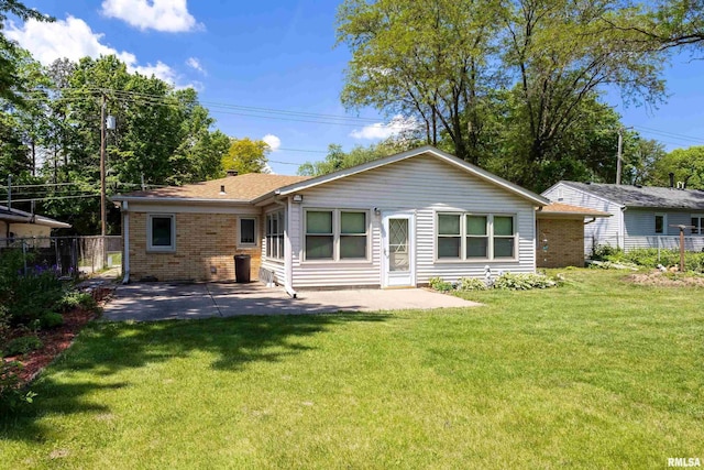 1119 14th St, Bettendorf, IA 52722 - rear view of house featuring a patio area and brick siding