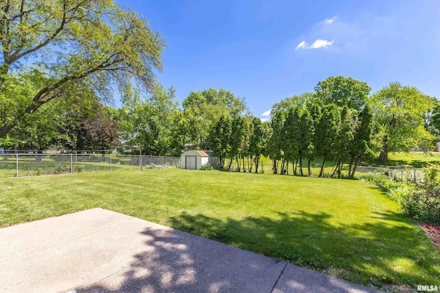 1119 14th St, Bettendorf, IA 52722 - view of yard with a patio and view of wooded area