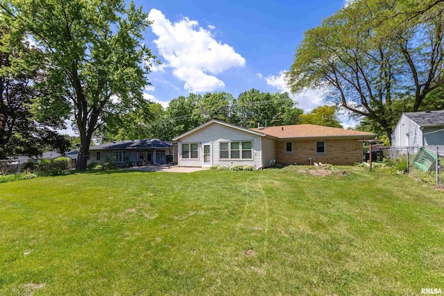 1119 14th St, Bettendorf, IA 52722 - back of property featuring a patio area