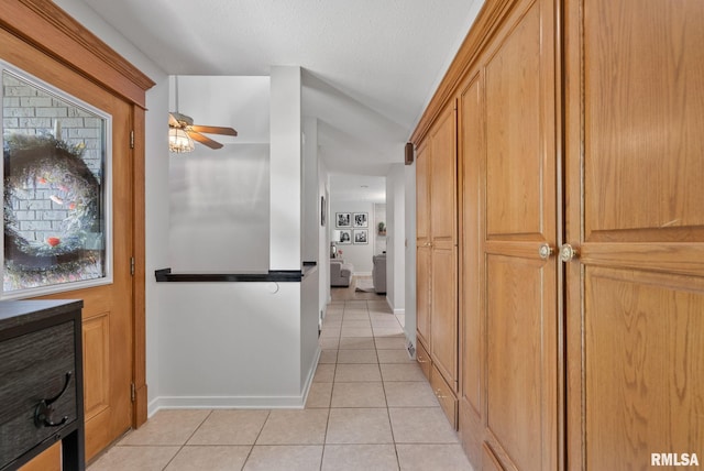 28013 230th St, Le Claire, IA 52753 - hallway with light tile patterned floors and baseboards