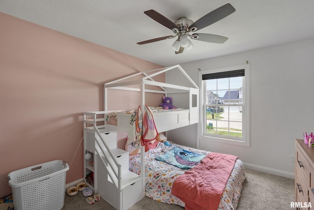 1625 W 71st St, Davenport, IA 52806 - bedroom with carpet, baseboards, and ceiling fan