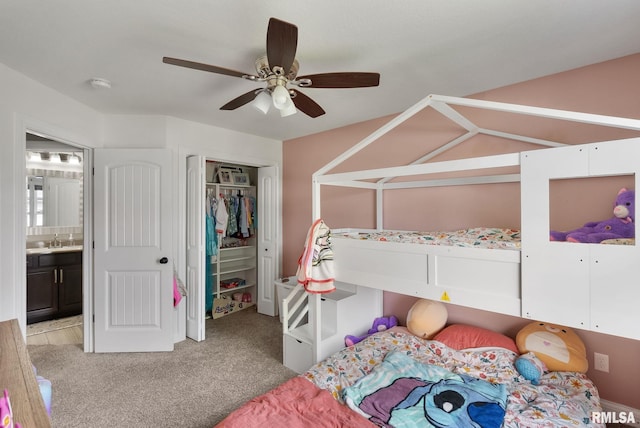 1625 W 71st St, Davenport, IA 52806 - bedroom featuring light colored carpet, a sink, a closet, and a ceiling fan