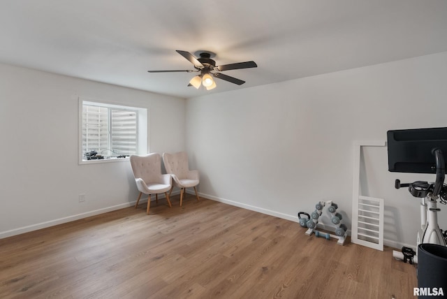 1625 W 71st St, Davenport, IA 52806 - living area featuring ceiling fan, wood finished floors, and baseboards